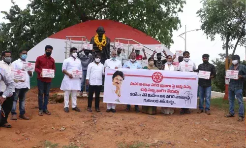 Jana Sena party leaders staging a protest against new property tax in Visakhapatnam on Tuesday