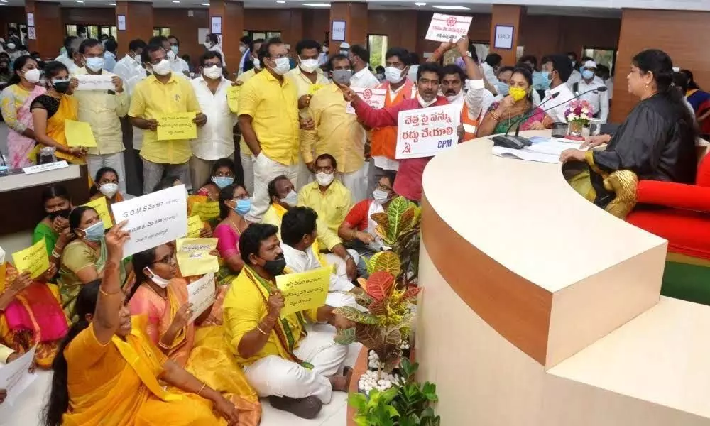 Activists of Left parties taking part in a protest outside the GVMC office in Visakhapatnam  on Wednesday