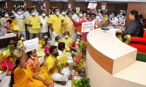 Activists of Left parties taking part in a protest outside the GVMC office in Visakhapatnam  on Wednesday