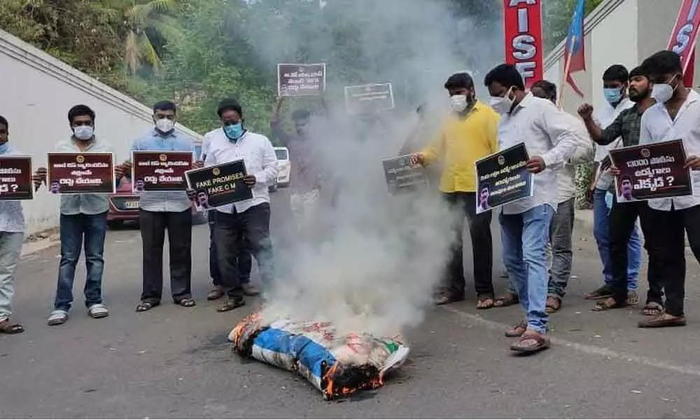 TNSF, AISF and AIYF leaders burning an effigy of government in Visakhapatnam on Thursday