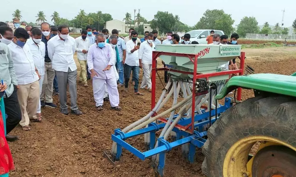 Officials of RARS, Polasa in Jagtial district demonstrating Direct Seeded Rice technology for paddy cultivation