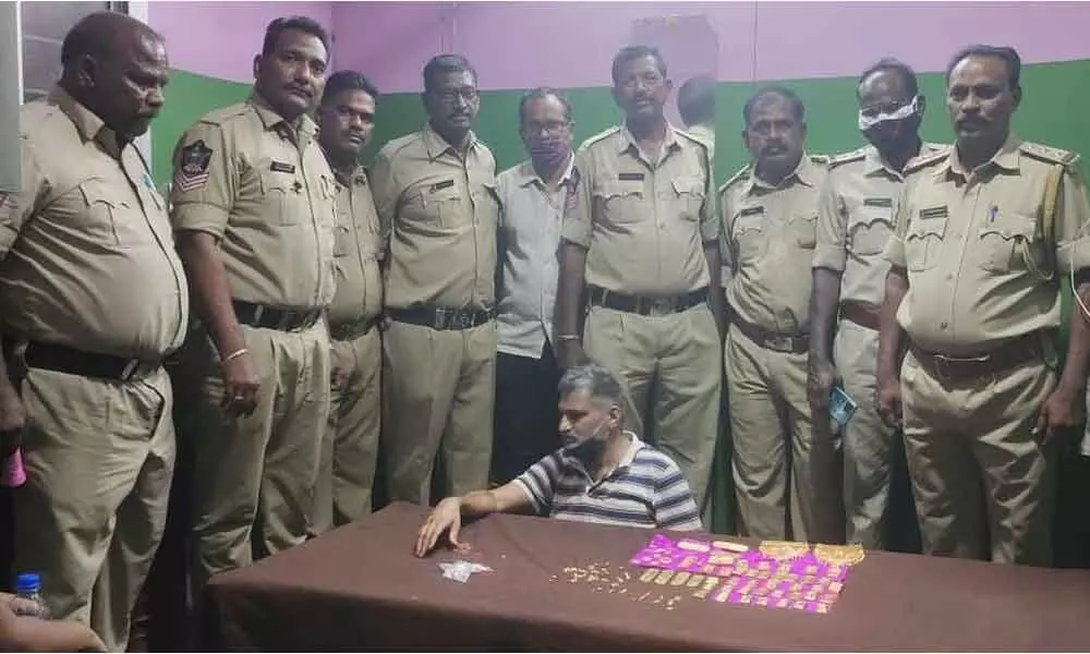SEB Circle Inspector P Srinivasulu and his staff with seized gold biscuits at Panchalingala border check post on Thursday.