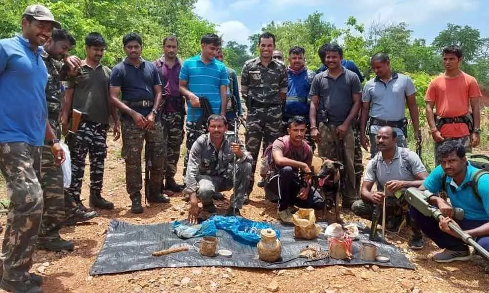 Police officials, bomb disposal team and dog squad with the explosives Koppunuru forest area