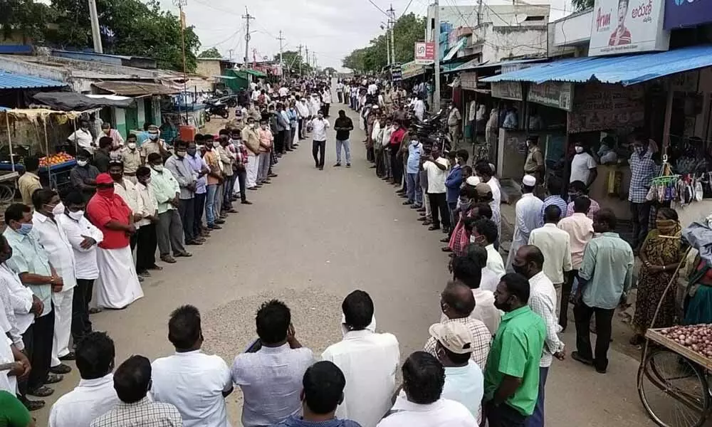People of Alampur along with various members from social organizations, different political parties and others forming a human chain and demanding the construction of a new 100 bed hospital for the region