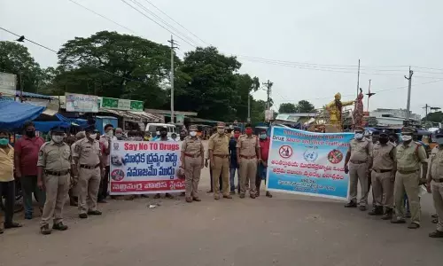 Excise officials participating in a rally against the narcotics and sedatives at Nellimarla in Vizianagaram district on Saturday