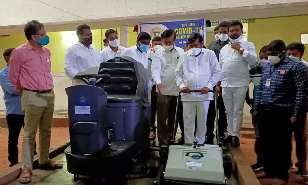 Energy Minister G Jagadish Reddy inaugurating cleaning machines worth Rs 10 lakh, donated by TDF of Astrin of US to the medical college in Suryapet