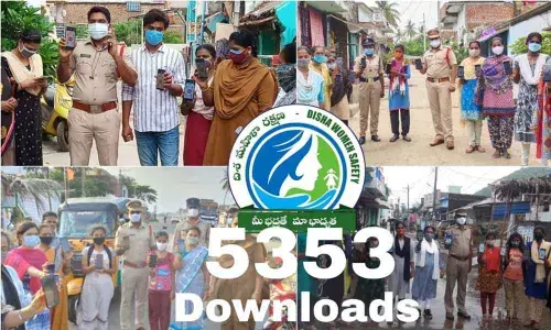 Police downloading the Disha app into mobile phones of women at various villages in Pathapatnam circle on Sunday