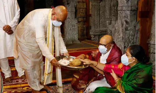 TTD EO K S Jawahar Reddy offering Srivari prasadam to Chief Secretary Aditya Nath Das at Tirumala on Sunday