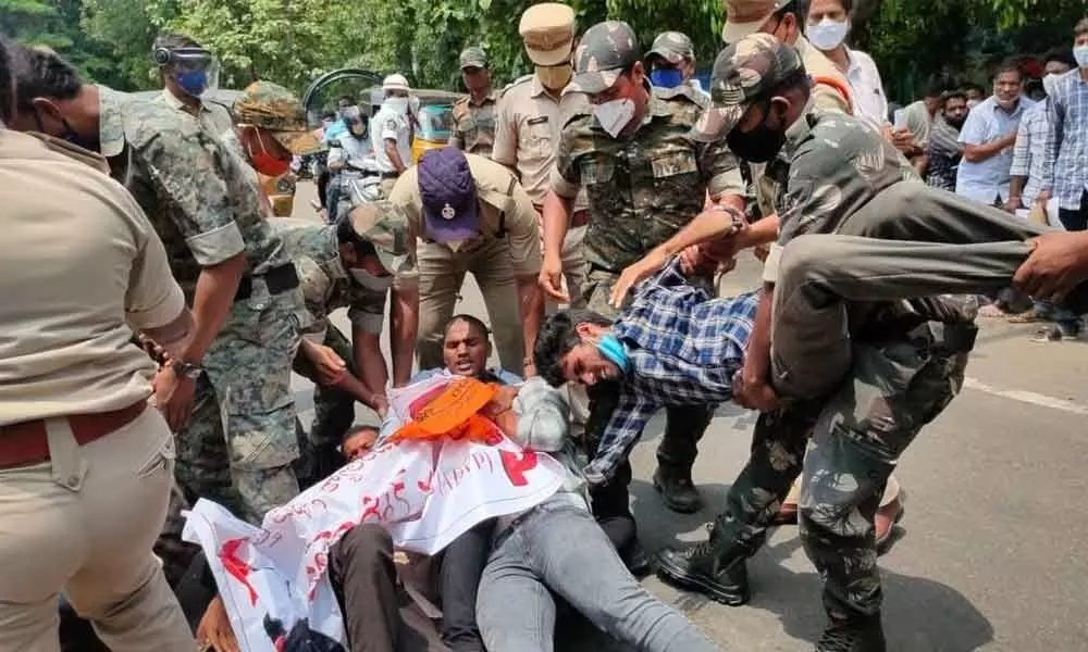 Activists of ABVP and SFI being  arrested by police at Vizianagaram Collector’s office on Monday