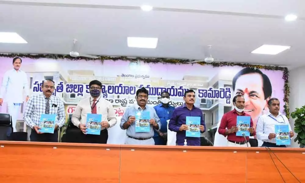 District Collector Dr A Sharath showing annual credit plan at a meeting with bank officials and district officials at a meeting at Kamareddy Collectorate on Tuesday
