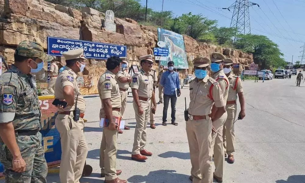 Police force on guard on the way to Nagarjuna Sagar Hydel power project on Wednesday