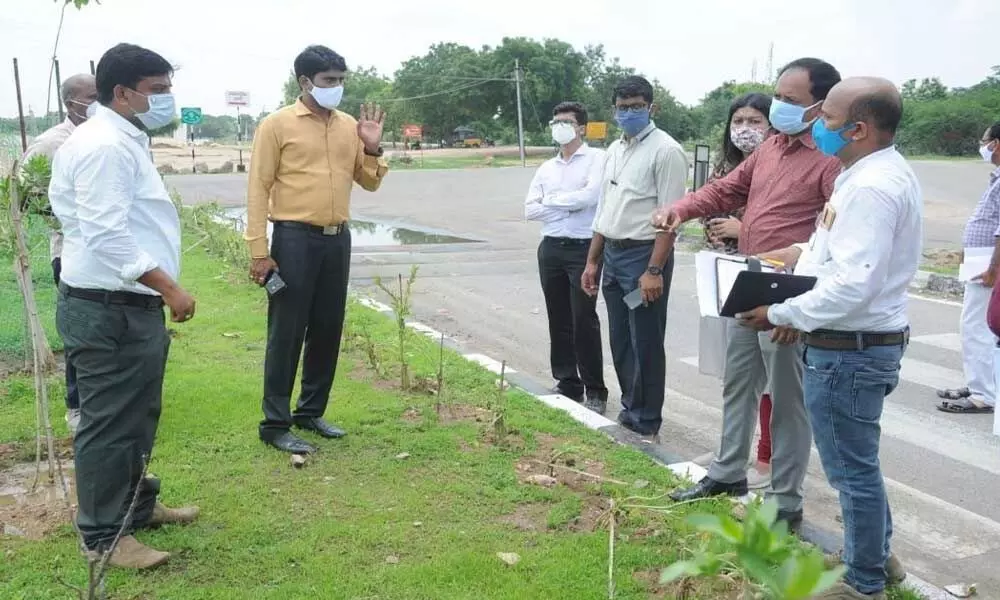 Collector Narayana Reddy planting saplings after Pattana, Palle pragati programme preparatory meeting in Nizamabad on Wednesday