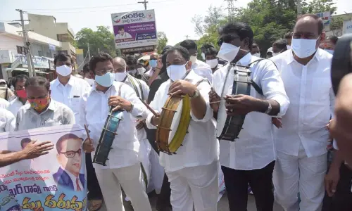 Transport Minister P Ajay Kumar and MLA Sandra Venkata Veeraiah beating drums during ‘Dappula Daruvu’ programme organised by Dalit organisations in Khammam on Wednesday