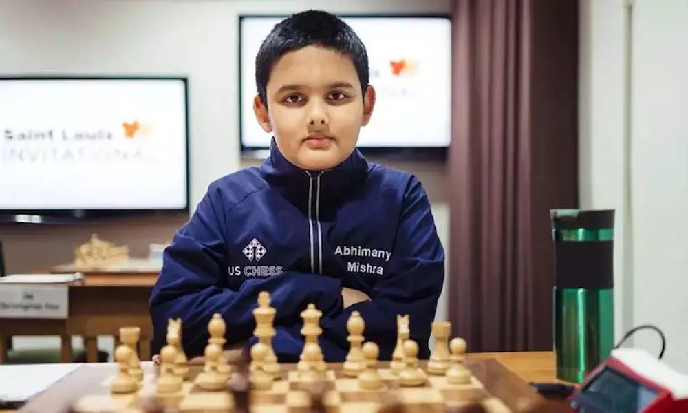 Anand congratulates the worlds youngest chess GM