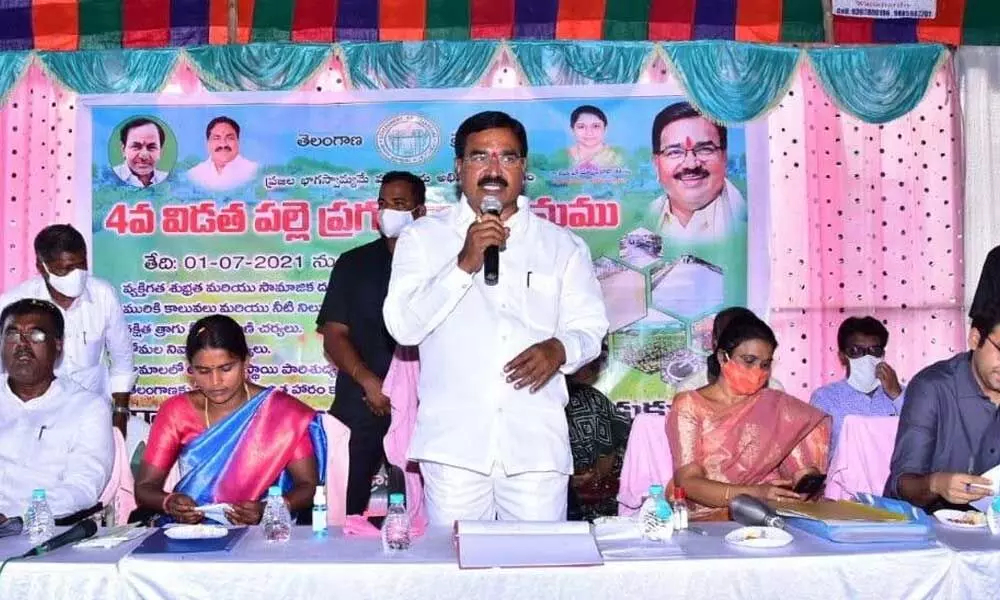 Agriculture Minister S Niranjan Reddy speaking at a meeting after launching the 4th phase of Palle Pragathi programme at Kadukuntla village on Thursday