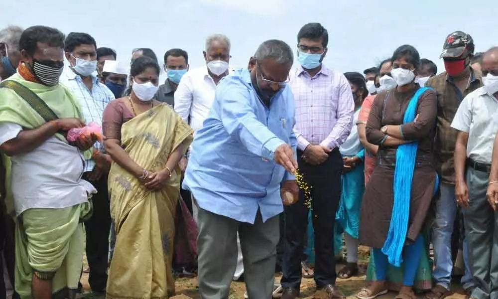 MLA K Veerabhadra Swamy laying foundation stone for houses in Vizianagaram on Thursday