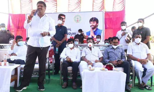 Tourism Minister M Srinivasa Rao speaking at the foundation stone laying ceremony of YSR Jagananna Colony