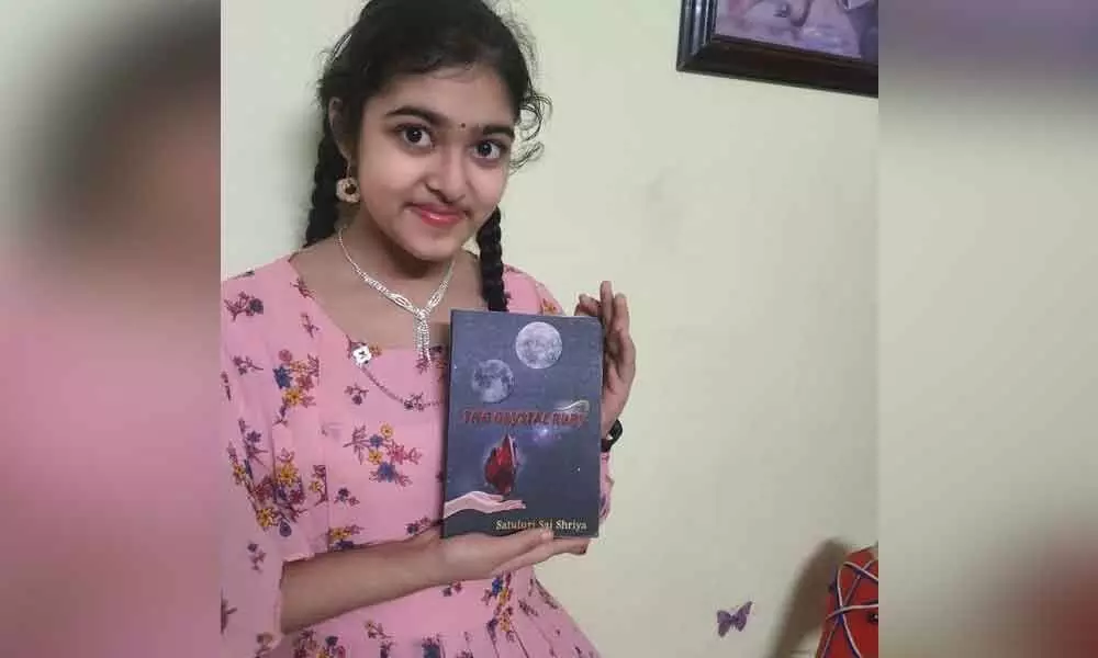 Satuluri Sai Shriya with her first book The Crystal Ruby in Visakhapatnam