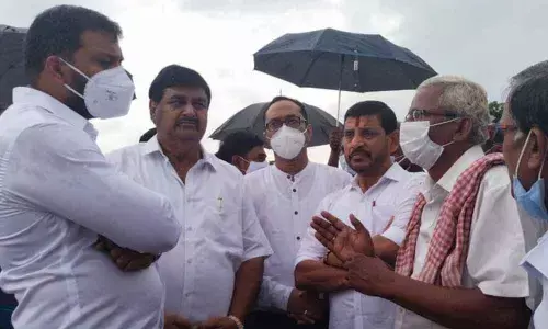 Minister for Water Resources P Anil Kumar Yadav interacting with farmers at Neradi village in Bhamini mandal in Srikakulam district on Friday