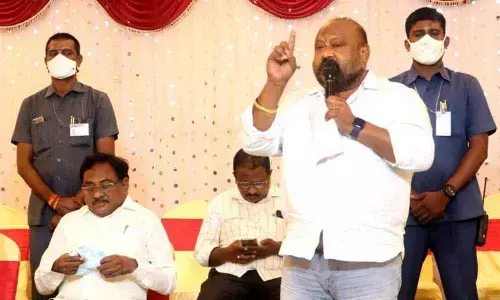 Minister G Kamalakar speaking at a rice millers meeting in Huzurabad, Karimnagar district on Friday