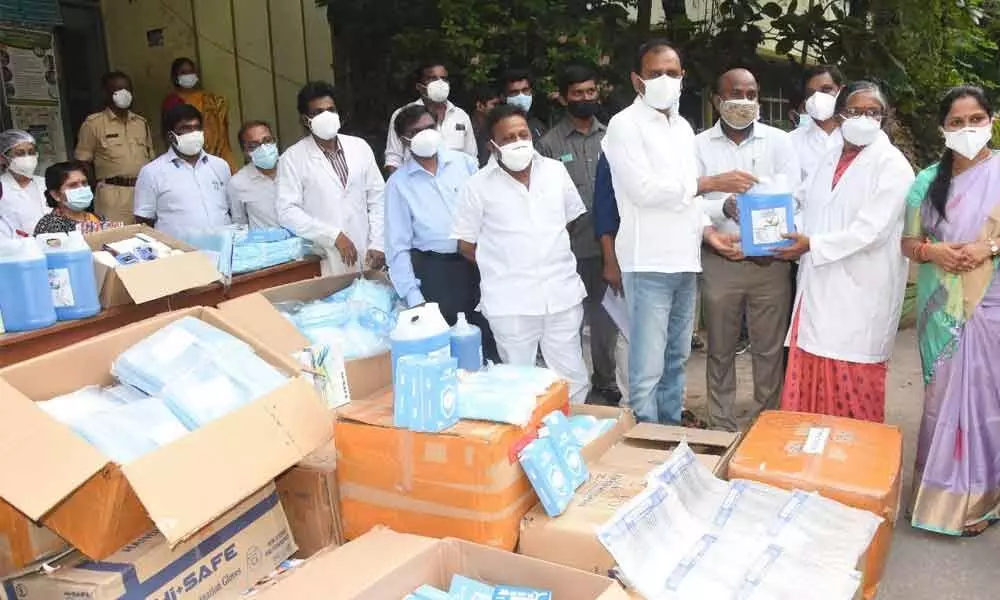 MLA Bhumana Karunakar Reddy handing over the medical equipment on behalf of APNRTS to Ruia hospital superintendent Dr T Bharathi in Tirupati on Saturday. Mayor Dr R Sirisha is also seen.