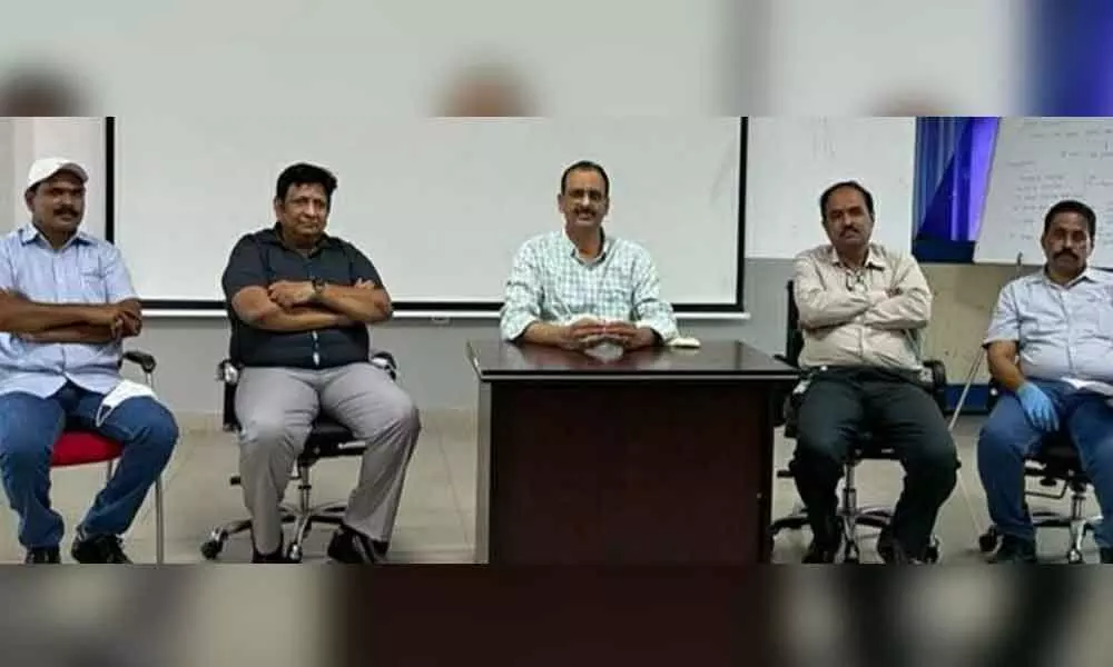 Aurobindo vice-president UNB Raju (middle) speaking at a press conference on the company premises at Pydibhimavaram in Ranastalam mandal in Srikakulam district
