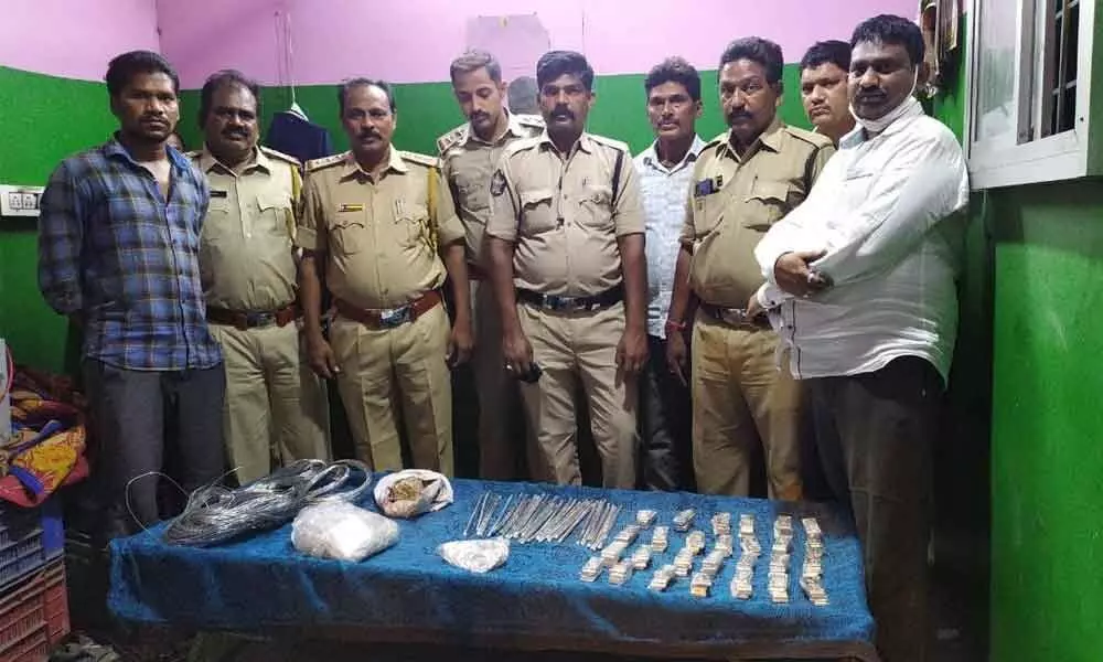 SEB Circle Inspector  P Srinivasulu and his staff with seized silver articles at Panchalingala border check post on Saturday
