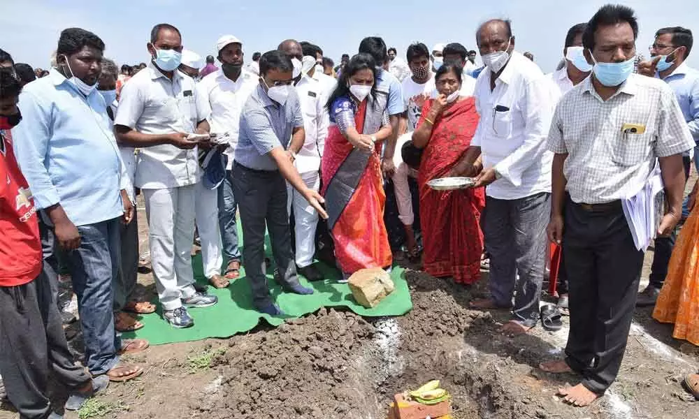 Collector Vivek Yadav and MLA Dr Undavalli Sridevi performing Bhumi Puja  for the construction of houses at Pedaparimi under Thullur mandal in Guntur  district on Saturday