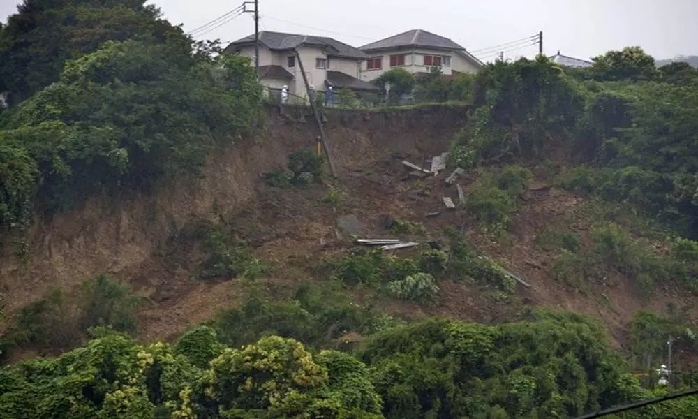 Search on for 20 missing persons in Japan mudslide