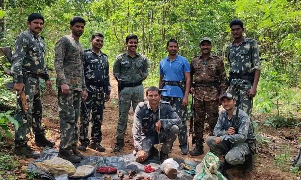 Security forces showing the explosives they unearthed at a forest location between Kaushettivai Gudem and Chouledu in Tadvai mandal in Mulugu district on Sunday