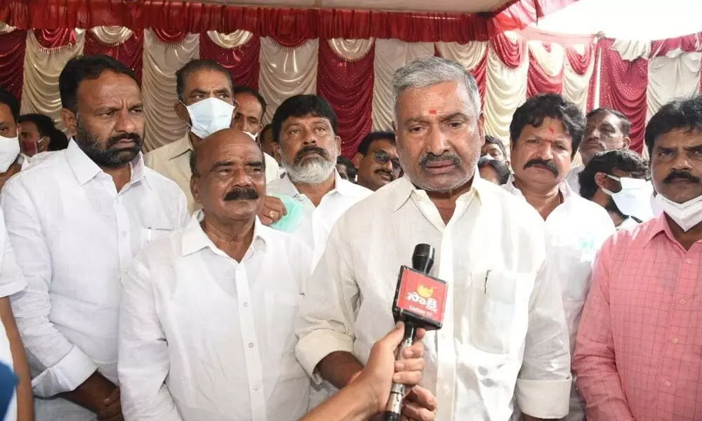Panchayat Raj Minister P Ramachandra Reddy speaking to media after visiting Chennakesava Swamy temple at Sompalyam village in Chittoor on Sunday. Chittoor MP N Reddappa is also seen