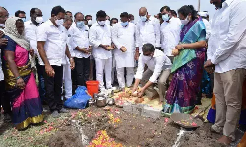 Home Minister Mekathoti Sucharita, Minister for Housing Cherakuvada Ranganatha Raju and Adviser to the Government Sajjala Rama Krishna Reddy performing Bhumi puja for the construction of houses at Kornepadu village on Sunday