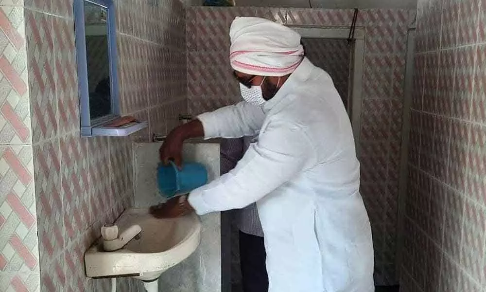 MLA Muthireddy Yadagiri Reddy cleans toilets