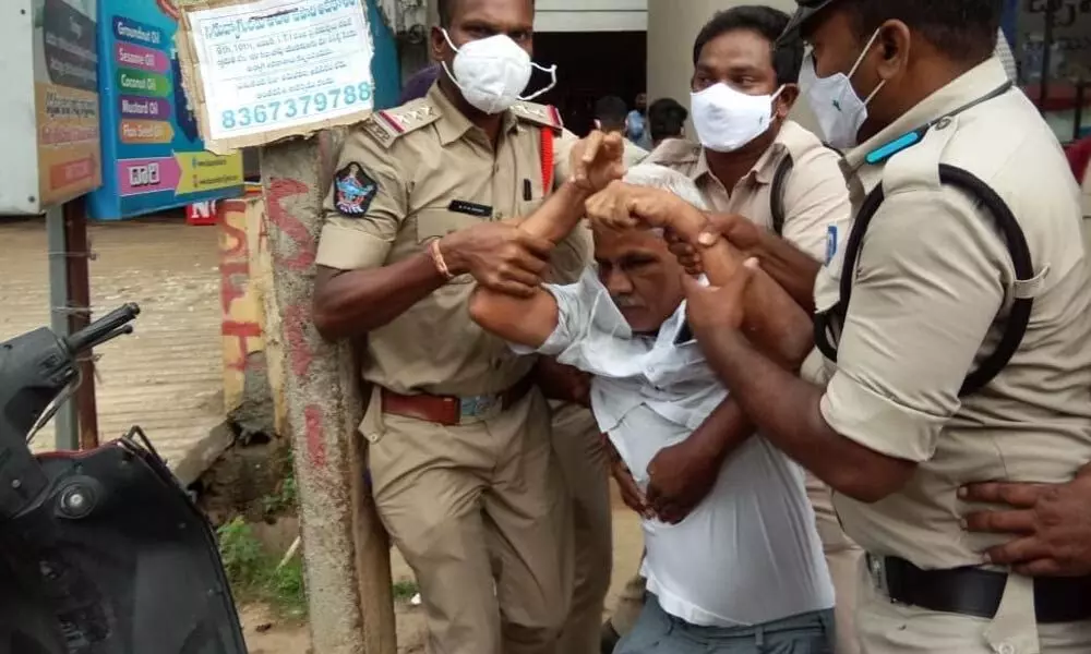 The police arresting CPM leaders at party office in Vizianagaram on Tuesday