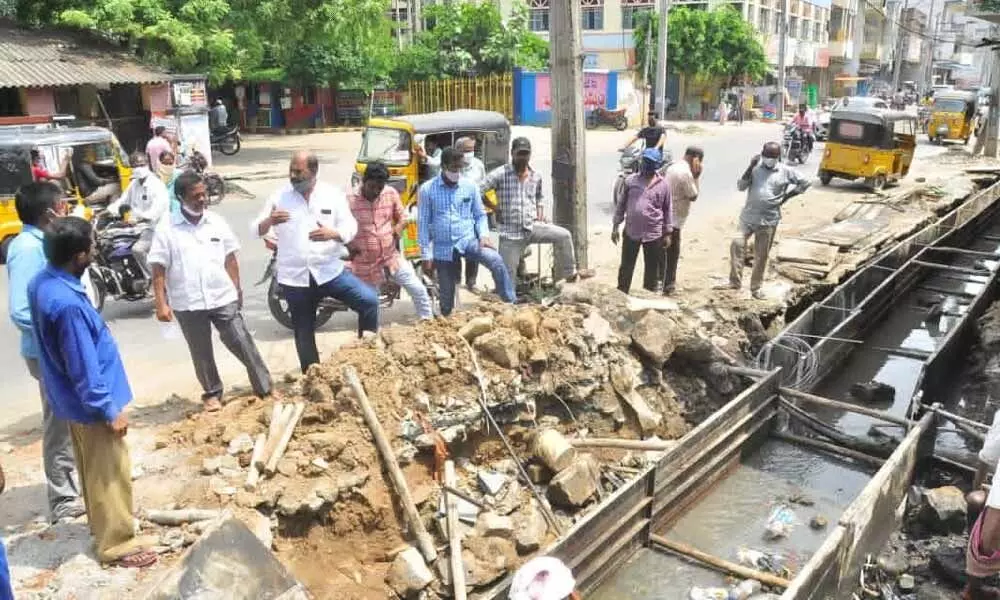 CPM leaders inspecting drainage construction works in two town in Khammam town on Wednesday