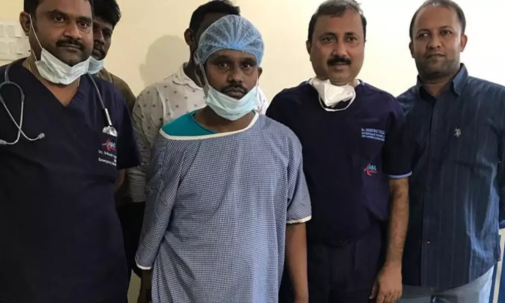 Dr Srinivas with the patient after conducting a successful surgery in Manchiral on Wednesday