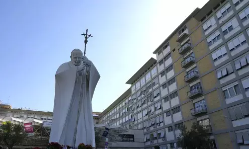The statue of Pope John Paul II is seen at the entrance of the Agostino Gemelli Polyclinic in Rome, Wednesday, July 7, 2021, where Pope Francis was hospitalized Sunday. (AP Photo/Alessandra Tarantino)