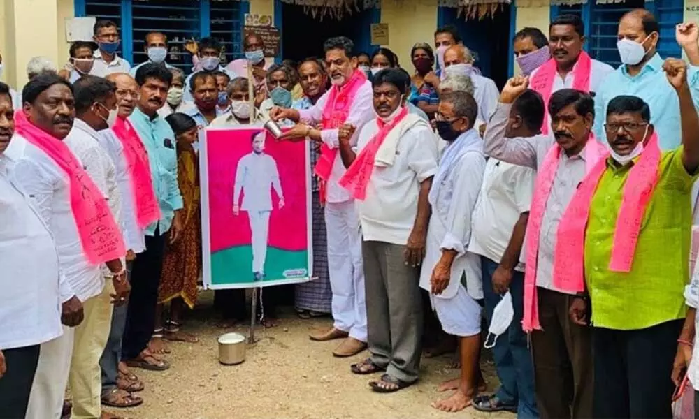 Former BC Commission member V Krishnamohan Rao performed Palabhishekam to CM K Chandrashekhar Raos portrait at Rampur in Karimnagar district on Thursday