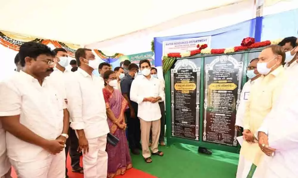 Chief Minister Y S Jagan Mohan Reddy unveiling plaques of various developmental works in Badvel on Friday.