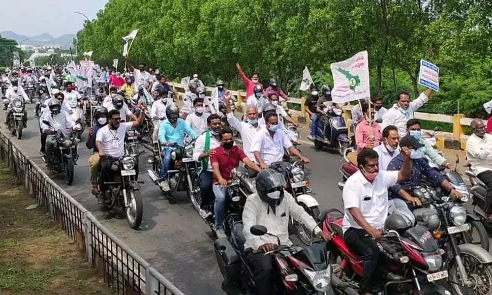 Agitators taking part in a massive two-wheeler rally organised by Visakha Ukku Parirakshana  Porata Committee in Visakhapatnam on Saturday