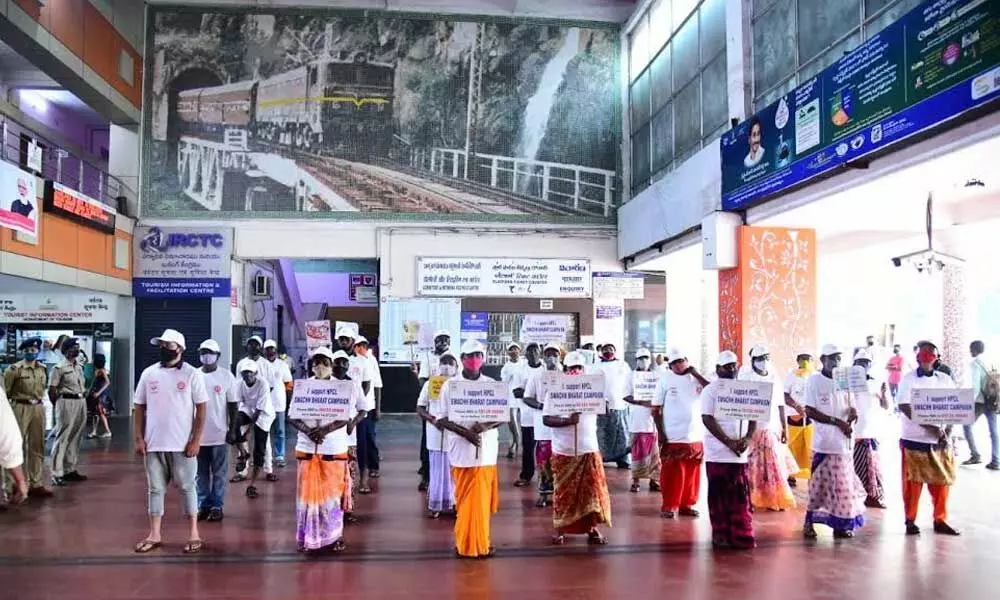 Swachh Bharat volunteers creating awareness on cleanliness at Visakhapatnam railway station on Sunday