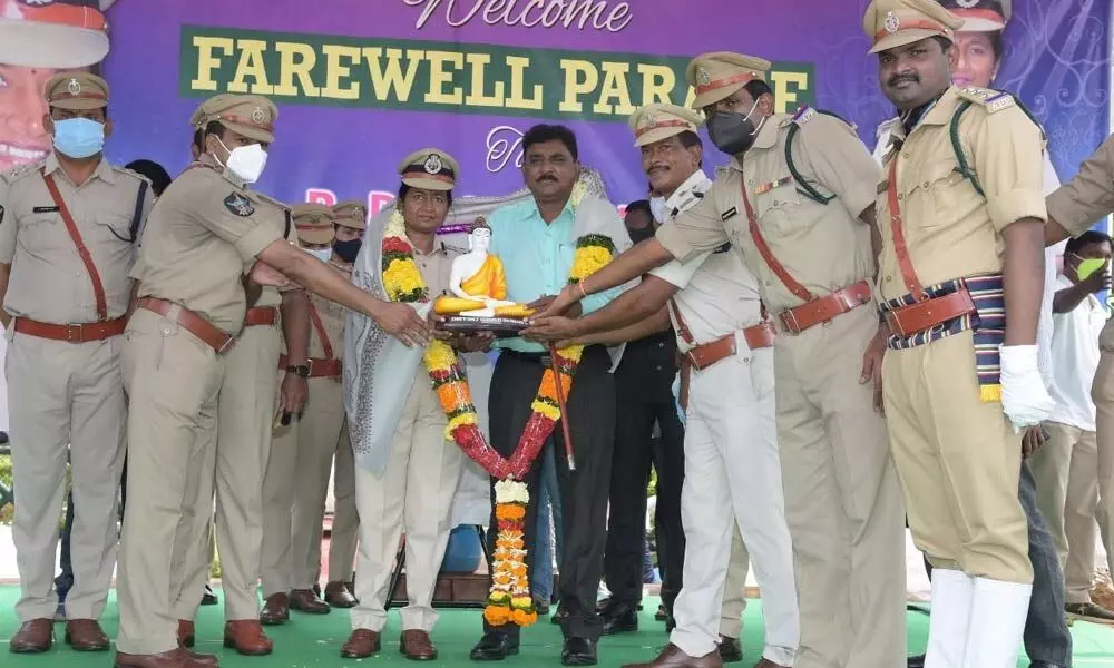 Police officers felicitating SP B Rajakumari in Vizianagaram on Sunday