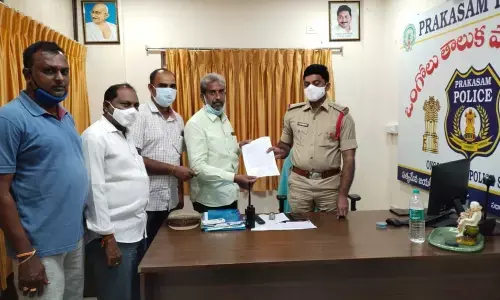 Prasanna Chennakesava Swamy temple chairman Edupalli Gurunatha Rao making a complaint to Ongole taluk police on Sunday