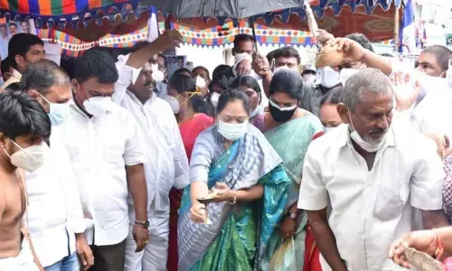 Home Minister Mekathoti Sucharitha and Mayor Kavati Siva Naga Manohar Naidu laying foundation stone for the construction of a Urban Health Centre at Gorantla in Guntur on Sunday