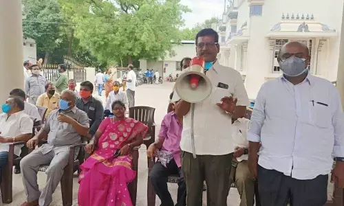 TTD employees’ leader Venkateswarlu addressing a meeting on house sites in Tirupati on Sunday