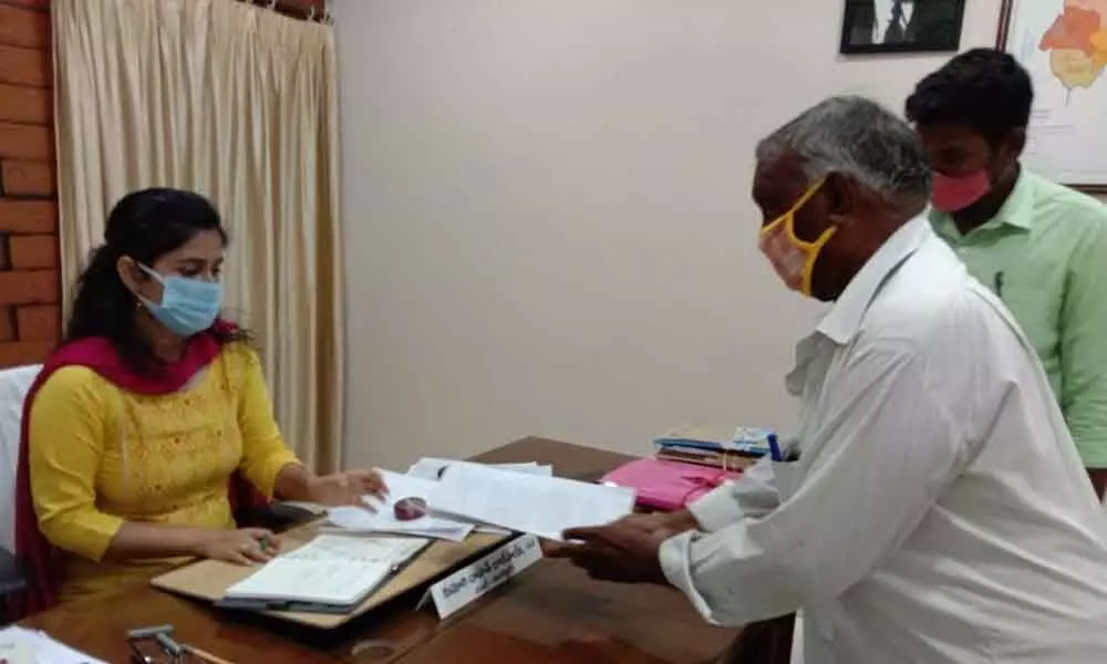 Sub-Collector Chahat Bajpai receives grievances as part of the Spandana programme in Nandyal on Monday.