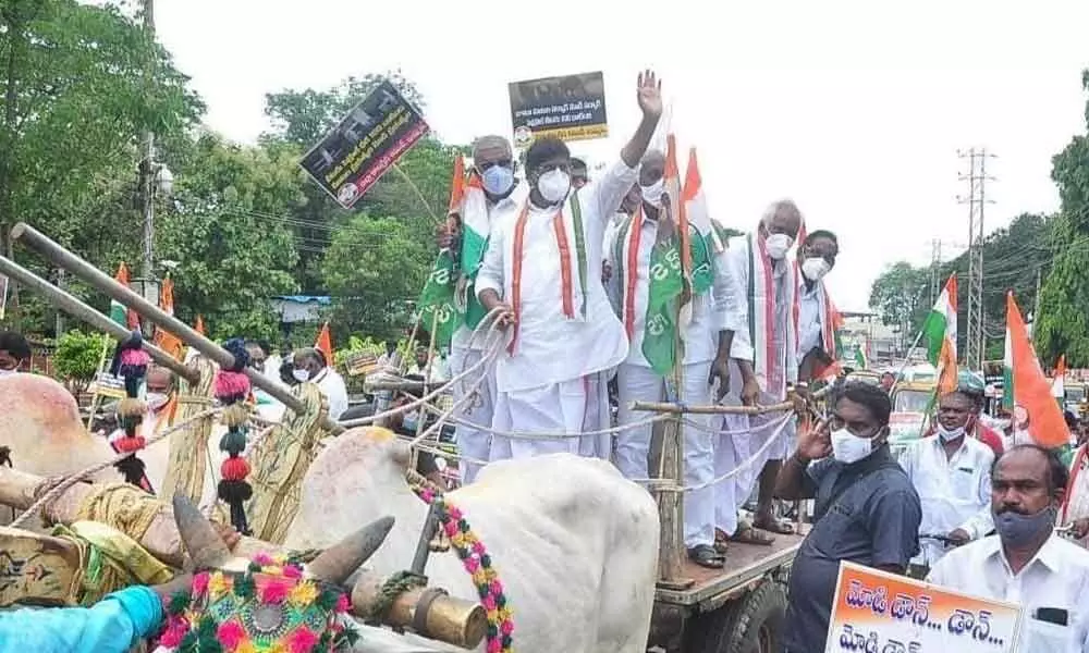 CLP leader Mallu Bhatti Vikramarka riding a bullock cart in protest against fuel price hike, in Khammam on Monday