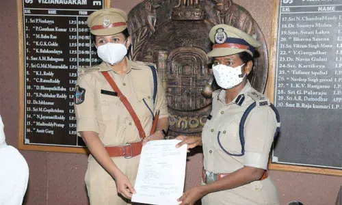New SP Deepika Patil (left) taking charge from B Rajakumari in Vizianagaram on Monday