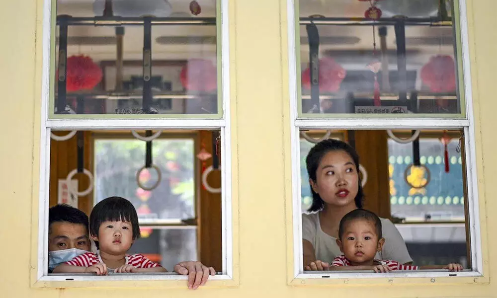 For some families in China, the three-child policy is another opportunity to try and have a boy. Photo: AFP