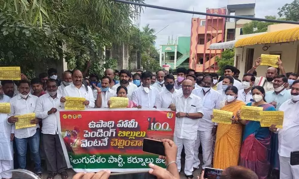 TDP activists staging a protest in front of the Collectorate in Kurnool on Tuesday